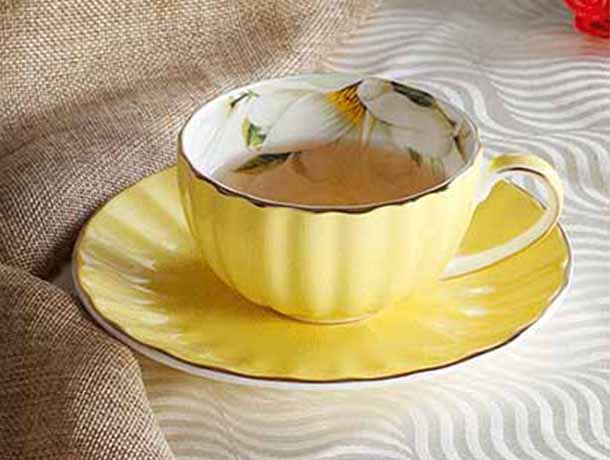 yellow cup and saucer